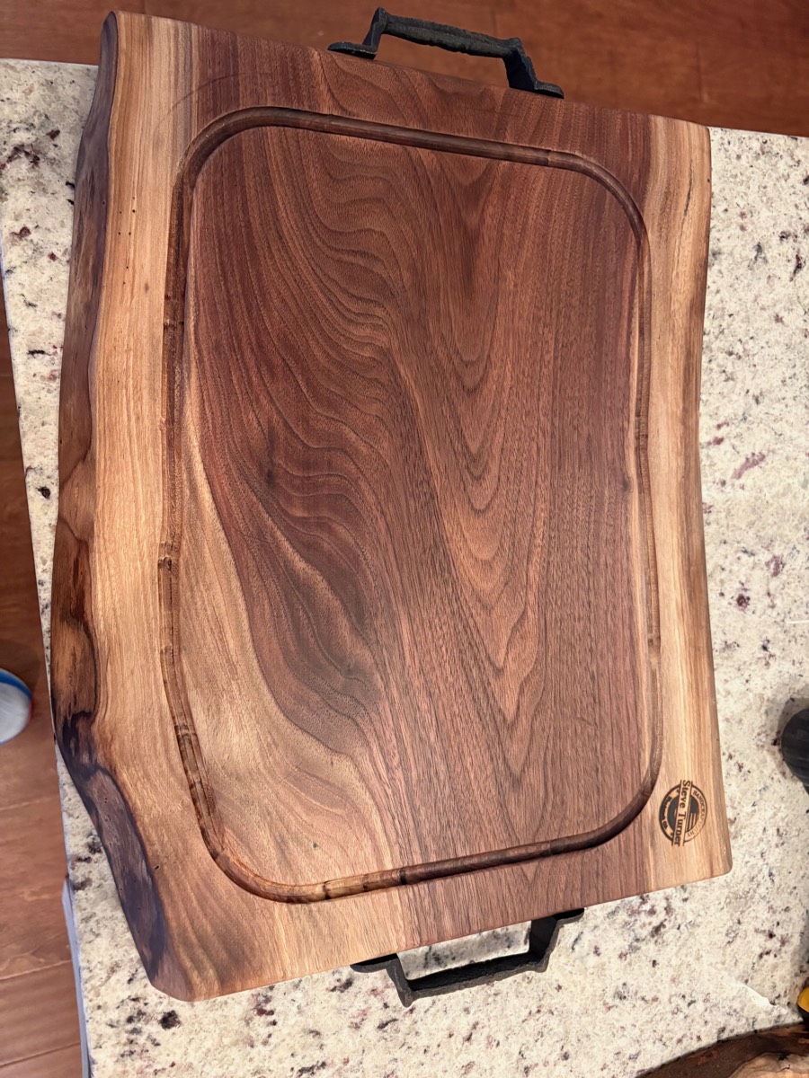 The Ironside — walnut carving board with forged iron handles and juice groove