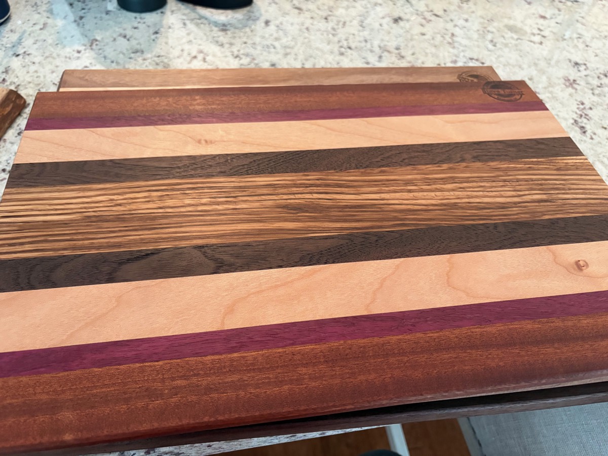The Strata — maple, walnut, wenge, purpleheart bold stripe board
